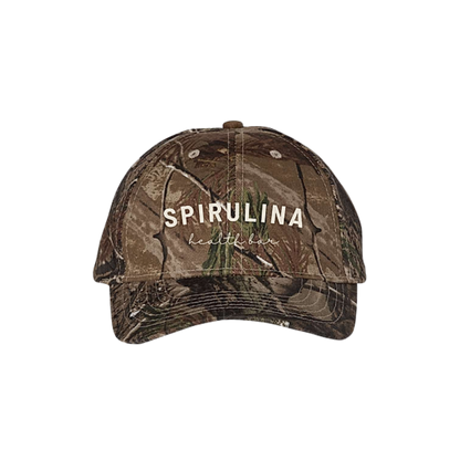 Camouflage cap with 'Spirulina Health' text on a white background